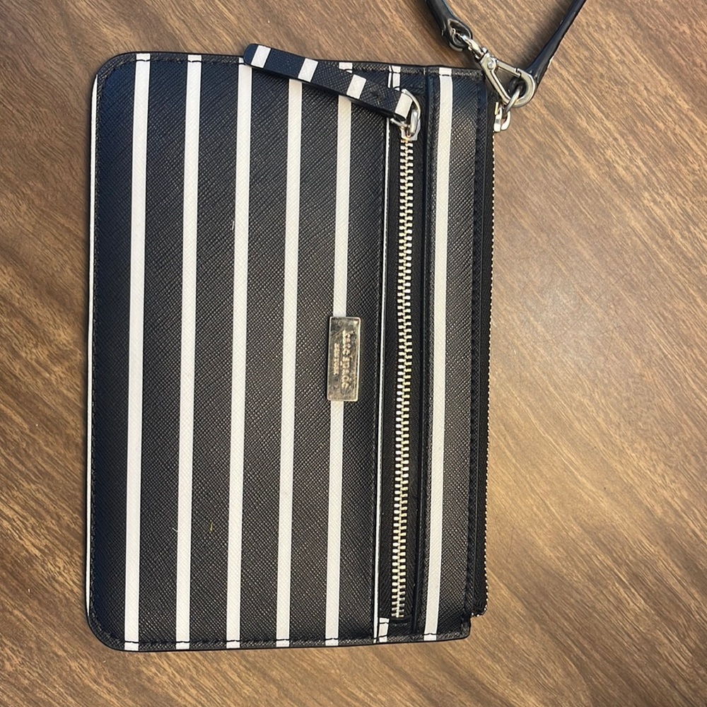 Brand new w/out tags Kate Spade wristlet. FREE WITH PURCHASE OVER 200 on my posh